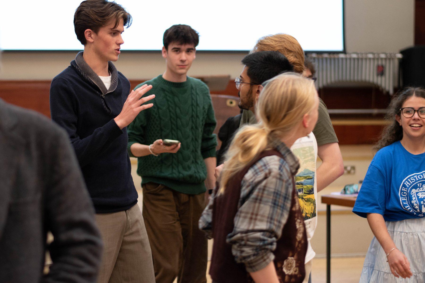 EUDU members talking before a session