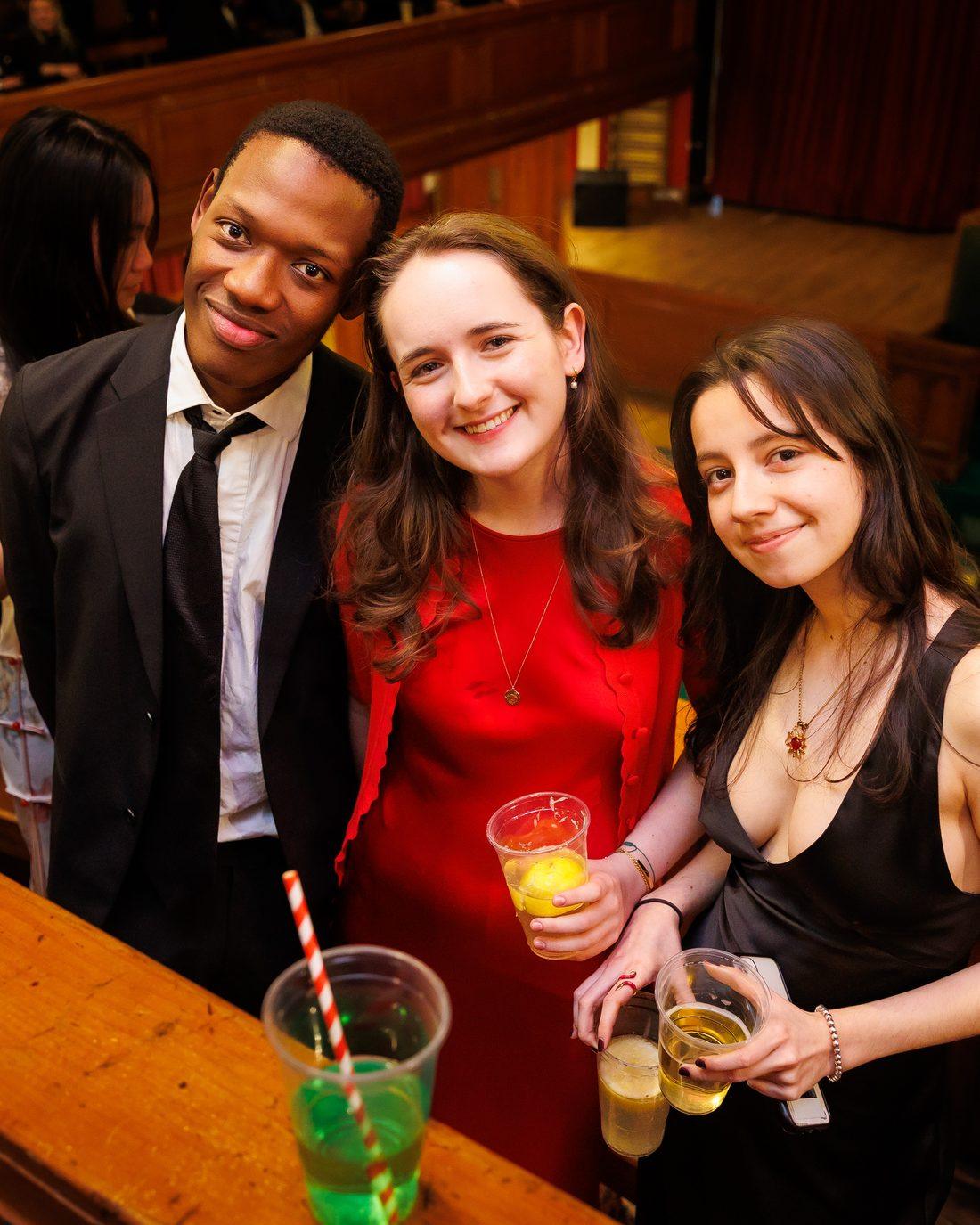 Three EUDU members with drinks at a union social